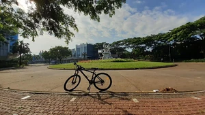 A bike in a park / I like riding my bicycle in the park. It's very relaxing and calming.