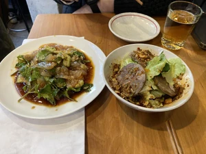 Lunch eaten on January 7, 2024, around noon. I ate this in the Okachimachi area of Tokyo. I dined with a friend, and we had an alcoholic drink and ate lamb with a side of cloud ear mushroom salad at a bar.