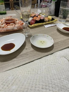 Dinner eaten on January 13, 2024 , around 6:00 P.M. I watched a movie with the person I'm dating as we ate. We had shrimp and sushi that we had purchased from Costco and the grocery store.