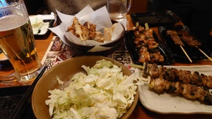 A photo of a dinner I went to have with my wife at a restaurant (grilled chicken skewers) on January 7 around 5:30 P.M.