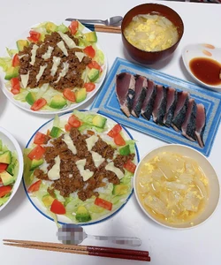 Dinner about a week ago eaten around 7:30 P.M. I ate it with my husband and my child. We turned on the T.V. and chatted as we ate. We had taco rice, egg drop soup, and sashimi. I prepared all the food shown.