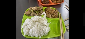 Lunch eaten three days ago around 12:30 P.M. I ate together with a friend, and we discussed work as we ate. I ate tofu, rice, and more. We discussed business with the ladies who worked there.