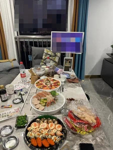 Photo taken of dinner eaten on January 1, 2024, at 7:00 P.M. We ate it at my aunt's home at a family gathering. We are sushi, seafood platters, and desserts made by my aunt.