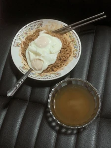 A photo of my lunch taken last month at home in the late morning. I ate by myself and watched a movie as I ate. I had instant noodles with a soup stock and eggs I had bought.