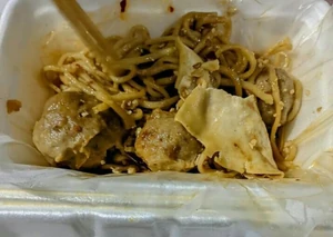 I ate mie jebew (fried noodles) topped with shumai for lunch.