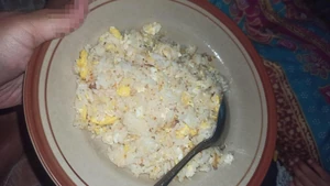 My dinner menu. I ate it late at midnight. This dish is called "nasi goreng putih."