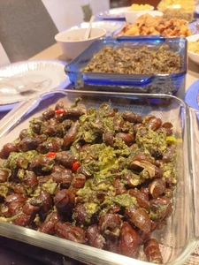 Lunch. Taken December 24, 2023, at 12:04 P.M. I ate at my mom's house. I ate with family. This dish is called tabagwang with laing (taro loeaves with meat or seafood cooked in coconut milk) in the background. Food was cooked by household help.