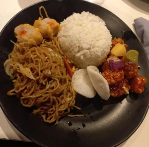 It was our dinner. I took the photo 2 days ago on Friday. The photo was taken at a Chinese restaurant. I was with my mom and my little sister to buy new clothes for my little sister's party. I ate pancit bihon (fried noodles) with sweet and sour pork and rice. We bought the meal from a Chinese restaurant.