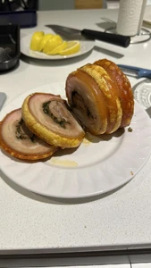 This is a photo of roasted pork belly roll. This food is part of our traditional midnight meal on New Year's Eve.