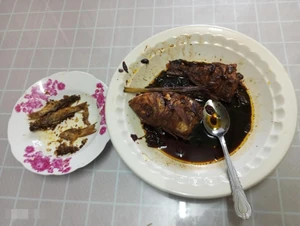 This is a meal my family and I had for dinner. The photo was taken during dinner last night around 9 P.M. I enjoyed this meal with my family members, eating spicy gravy and salted fried fish with rice. My mom and sister proudly made this meal...yummy