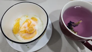 Breakfast before my fast. I ate this on Monday, January 15, 2024, at 5:45 A.M. with my wife. I had an almost hard-boiled egg with butterfly pea flower tea with lemon juice and honey mixed in.