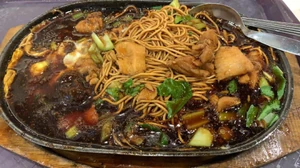 I usually eat this during my dinner and sometimes lunch. / I took this pic on January 21, 2024, which was 3 days, ago at 1:54 P.M. / I ate the food with my friend. / I ate the food of course. / The food is called Sizzling Yee Mee. / I bought it at Lotus