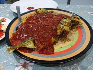 It was dinner time just now. I had rice and fried fish with sambal. I had the meal with my husband and kids. I am the one preparing the meals. The fish were bought at nearby local shop.