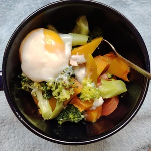 Breakfast taken on Wednesday, 17th January 2024, at 9am at home alone. It contains a half boiled egg, broccoli, pumpkin and sesame salad dressing. It was prepared by my spouse before leaving for work.