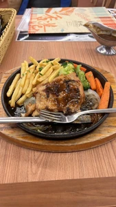 It was lunch. I took it two days ago. I was eating alone. I was eating chicken chop hot plate with grilled vegetables.