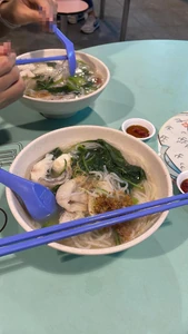 This photo of Fish Soup Noodle was taken during my dinner with my wife on the 22nd of December at 7:27 P.M. at a hawker centre at Ghim Moh Market. We were looking for food and the noodle store looked appealing.