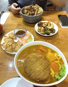 It was New Year's lunch with my best friend. We went to a vegetarian place near her house to have lunch. I ordered the Japanese curry udon noodle with cutlet while she had the tendon and we ordered dumplings to share.