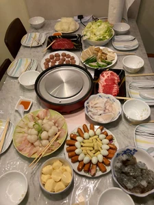 Dinner at my mum's during New Year's Eve. / With my family - mum, siblings, husband, and son. / I helped prepare the hot pot meal. The meal was mainly prepared by my siblings, and I contributed the iberico pork belly.